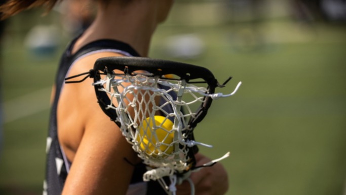 female athlete lacrosse net womens sports close up girl shoulder